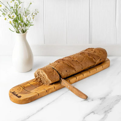 Tableau de coupe de baguette artisanale en bois d'olivier pour les amateurs de pain