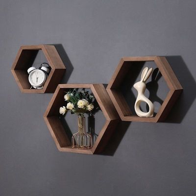 Étagères en bois en forme d'hexagone géométrique pour un organisateur de bureau de style moderne simple