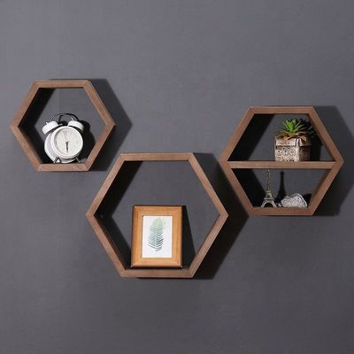 Étagères en bois en forme d'hexagone géométrique pour un organisateur de bureau de style moderne simple