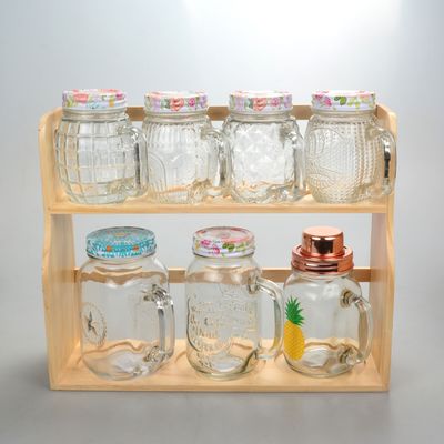 Un bocal de verre élégant et transparent avec un couvercle en plastique de couleur 100% sans danger pour les aliments
