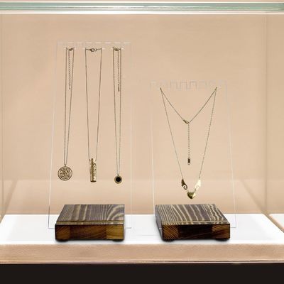 Porteur de collier en acrylique transparent avec base en bois massif