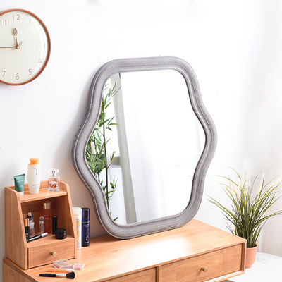 Miroir de chambre avec cadre ondulé et logo personnalisé