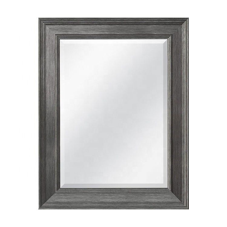 Décoration du salon de la ferme rustique miroir suspendu au mur en bois en plain colo